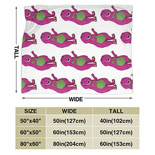 Blanket with purple and green dinosaur pattern and size chart.