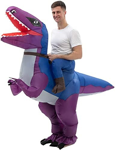 Man wearing a purple and blue inflatable dinosaur costume.