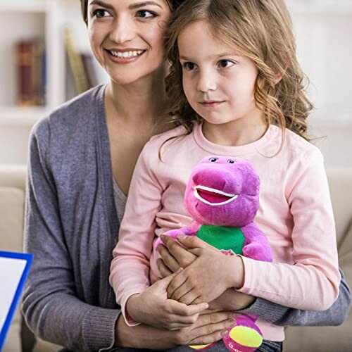 Mother and daughter sitting with a purple dinosaur toy.